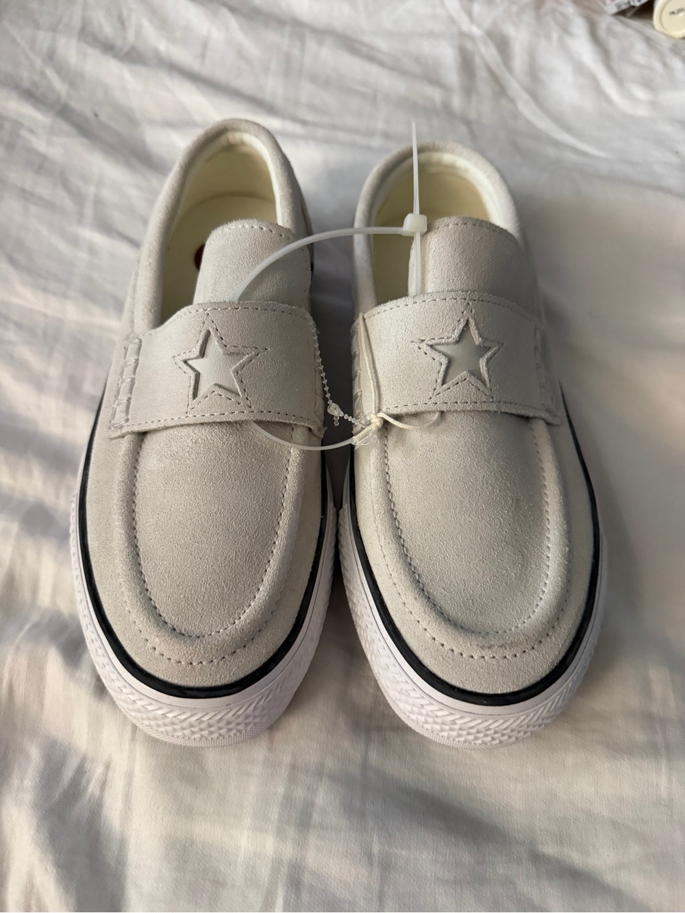 Converse Cream Slip-On Sneakers with Black Midsole Stripe